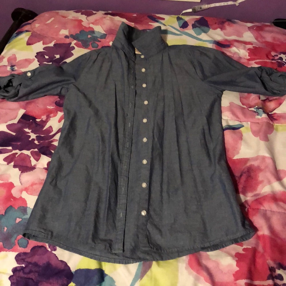 Blue jean button down shirt.